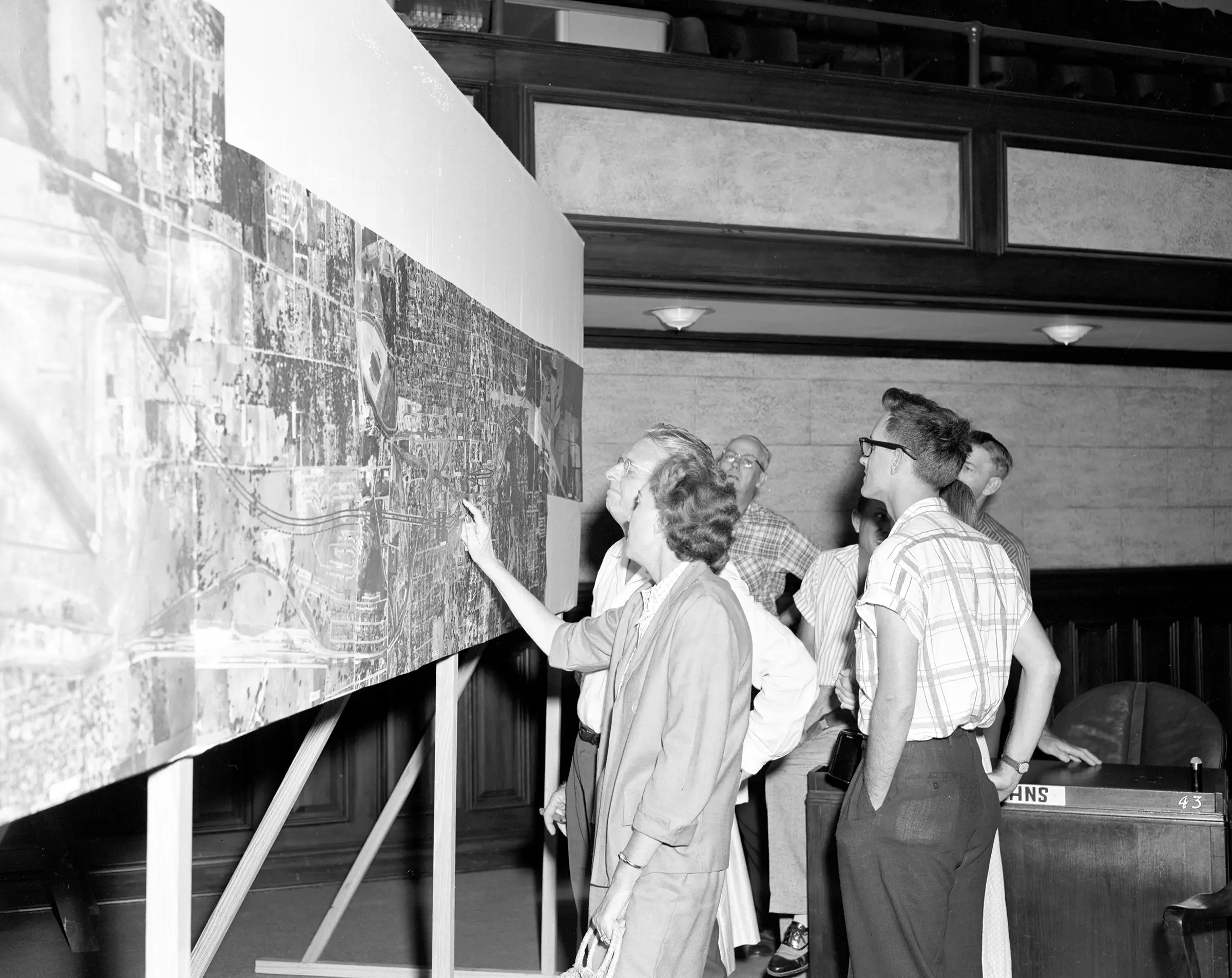 Archival Photo of Citizens Reviewing a Planning Map